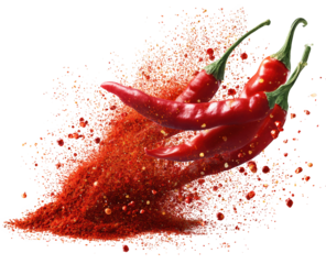 Explosion of red chili peppers and powder against a black background.