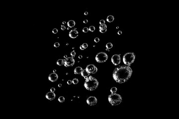 White bubbles, liquid, black background, abstract isolated, oxygen design concept, underwater,...