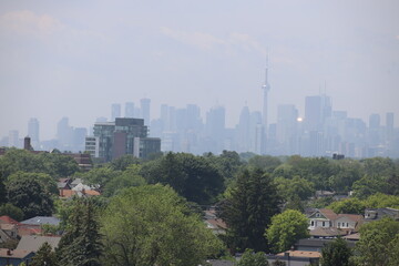 Fototapeta premium Landscape view of Toronto downtown in summer, photo was taken from East York, Toronto. The photo was taken in East York on 30 June 2025