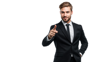 Young businessman in a black suit pointing forward with a smile, isolated on transparent background