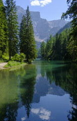 The Braies side of the Dolomites, Italy, offers breathtaking landscapes, crystal clear lakes and majestic mountains, perfect for enjoying nature.