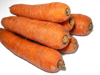 Young fresh washed carrots on a white background