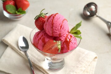 Tasty sorbet with strawberries and mint served on light table, closeup