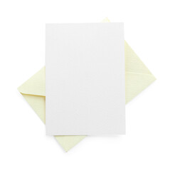Blank invitation card and envelope isolated on white, top view. Space for design