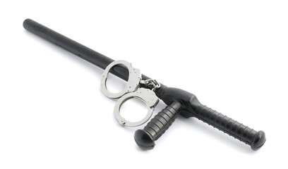 Police baton and handcuffs on white background