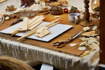 Creative process of making a wooden organizer for a dried flower collage. Wooden planks, natural...