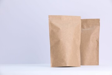 Zipper stand-up pouches on white background. Mockup for design