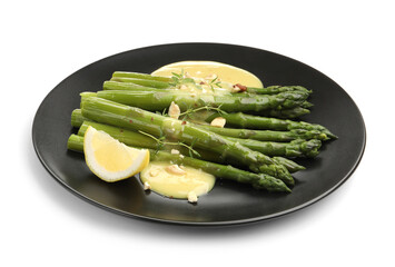 Tasty cooked asparagus with lemon and sauce isolated on white