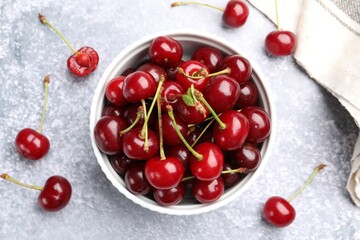 Fresh ripe cherries on light table, flat lay
