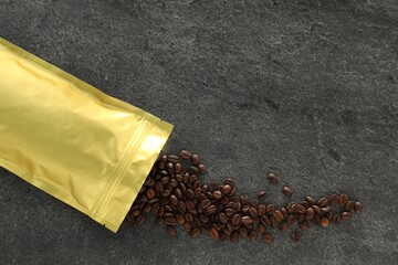 Zipper stand-up pouch and coffee beans on grey table, flat lay. Mockup for design