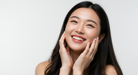 Smiling woman with dark hair touching face portrait