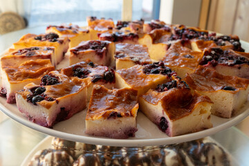Pastry dessert with cherry topping, sweet confectionery treat with fresh cherries and creamy filling