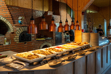 Romanian restaurant with cozy home atmosphere featuring traditional dishes served on the table for authentic dining experience
