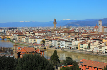 Florence City in Central Italy with many famous landmarks and Arno River and mountains  with snowed...