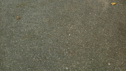 Textured Asphalt Pavement: Detailed macro photography of a coarse asphalt surface, showcasing its granular composition and subtly varying tones.