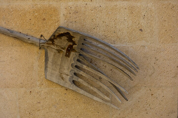 old rusty pitchfork on the ground