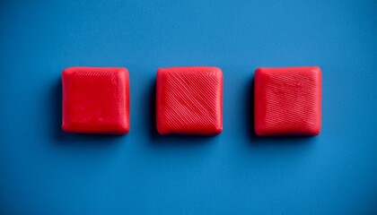 Fototapeta premium red square seamless made from plasticine on blue