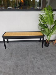 A lush green plant stands beside it, enhancing the tranquil and modern aesthetic of the space. The...