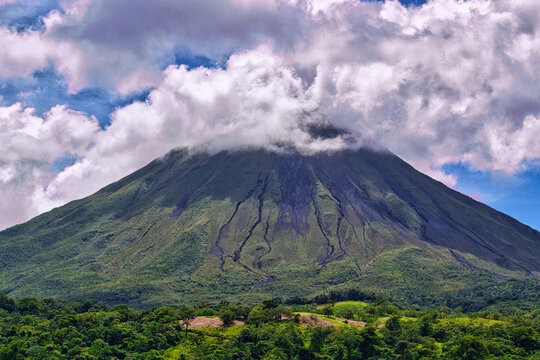 Arenal Volcano partially covered by clouds of the humid tropics, Costa Rica