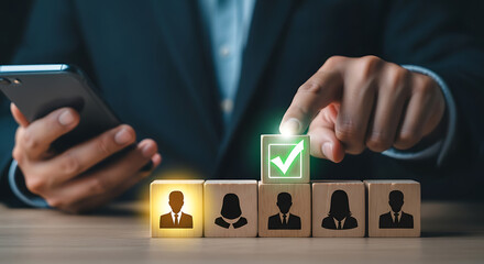Person selecting candidate with checkmark on wooden block business selection