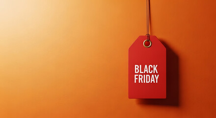 Red tag with black friday text hanging on orange background sale discount