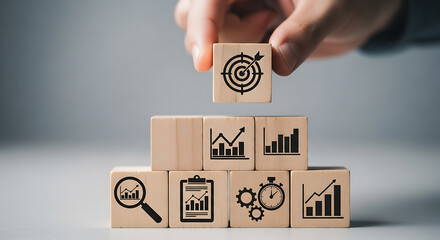Wooden cubes with business growth icons target icon graph icon