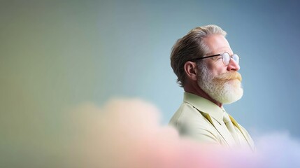 Penisve Senior Man with Beard and Glasses in Profile, Soft Blue and Pastel Cloud Background