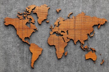Wooden world map art piece displayed against a textured gray background