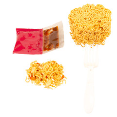 Cup of instant noodles, condiments, plastic forks on white background