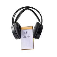 We listen text written on notebook covered with headphones.