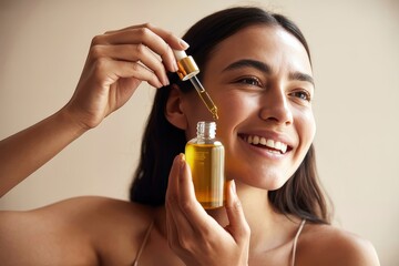 Fototapeta premium Smiling woman applying facial oil serum