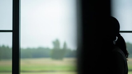 Serene Woman Meditating by Window: Finding Peace and Mindfulness at Home