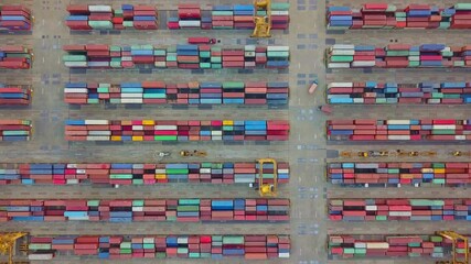 Aerial view of cargo containers in a shipping port terminal - Powered by Adobe