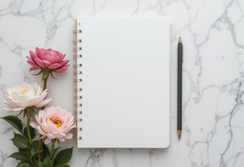 Obraz premium Notebook Mockup with Pink and White Flowers on Marble Background