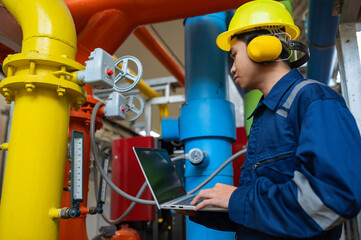 Maintenance technician at a heating plant,Petrochemical workers supervise the operation of gas and...