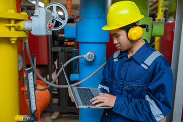Maintenance technician at a heating plant,Petrochemical workers supervise the operation of gas and...