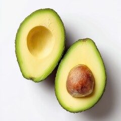 Two halves of avocaa on a white surface