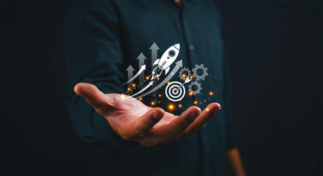 Businessman holding digital icons representing technology data innovation and network strategy