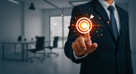 Businessman pointing at dartboard target icon showing success focus strategy and goal achievement