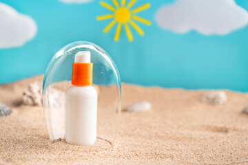 Sunblock or sunscreen in cosmetic tube under a glass dome as a symbol of sun protection on beach sand background. Summer vacation and skin care concept, spf uv-protect cosmetics. Skin health.