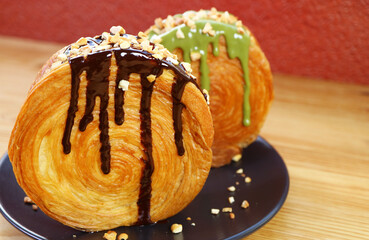 Mouthwatering Timber Ring Croissant with Chocolate Ganache and Chopped Nuts