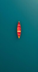Fototapeta premium Minimalist aerial view of a bright red rowboat floating on calm teal water