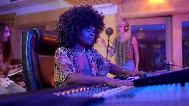 Skilled music producer working in professional recording studio