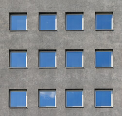 Square Shape Blue Tint Windows at Grey Facade Building