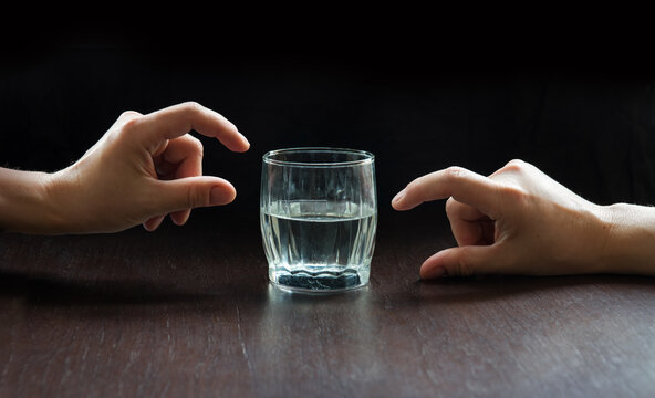 An optimist and a pessimist's opinion about a glass of water