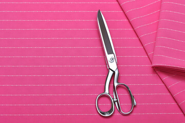 Flatlay of neon pink suiting fabric with white line pattern—ideal textile background for fashion,...