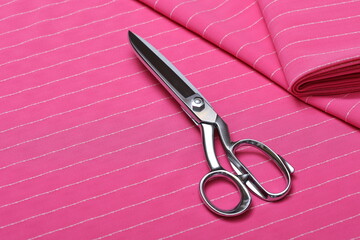 Flatlay of neon pink suiting fabric with white line pattern—ideal textile background for fashion,...