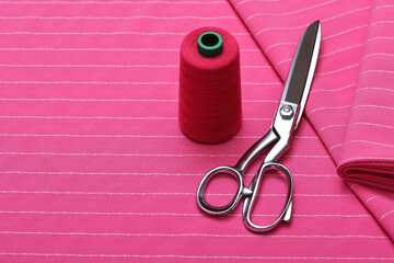 Flatlay of neon pink suiting fabric with white line pattern&mdash;ideal textile background for fashion, tailoring, and design concepts. Premium quality cloth texture for elegant and modern themes. 