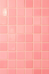 Fototapeta premium Pink Glossy Square Ceramic Tile Wall Background Seamless Grid of Pastel Pink Tiles with Soft Reflection