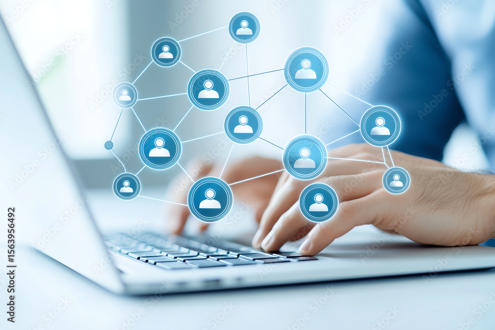 Poster person using laptop with digital network interface representing cloud storage and social connections